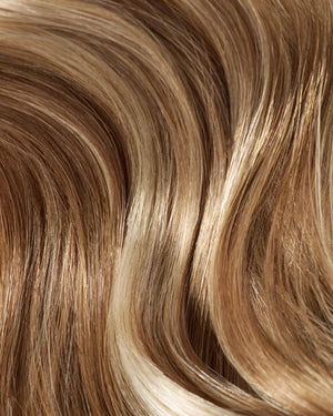 Golden brown hair extensions with beige blonde highlights for a soft natural blend