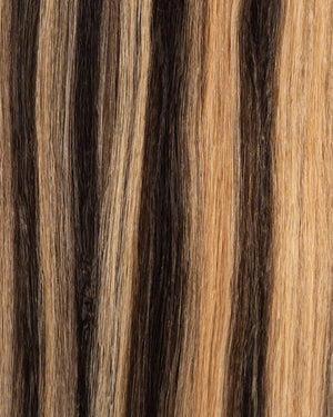 Classic black hair extensions with caramel honey highlights for a natural finish