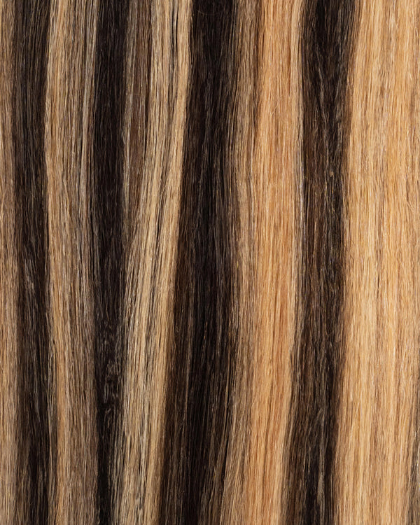 Classic black hair extensions with caramel honey highlights for a natural finish