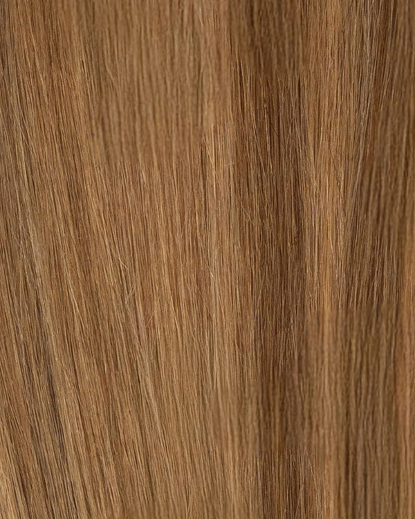 Golden brown hair extensions featuring beige blonde highlights for a soft contrast