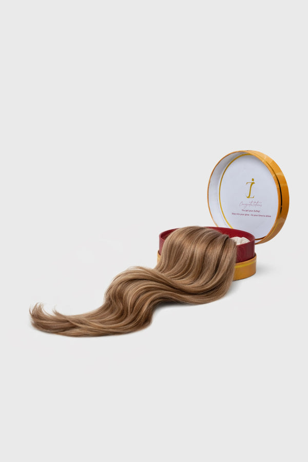 Golden brown clip in hair extensions with blonde highlights for a warm tone