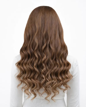 Brown hair extensions with blonde highlights in a cool toned finish